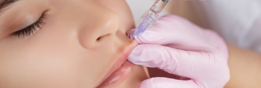 close up photo of woman getting juvederm injections in her lips